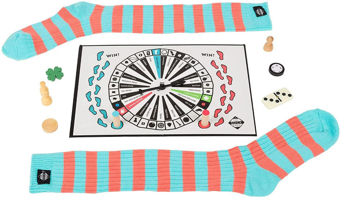 Two blue and coral striped socks, a spinner board, and various game pieces like a domino, dice, and a clover.