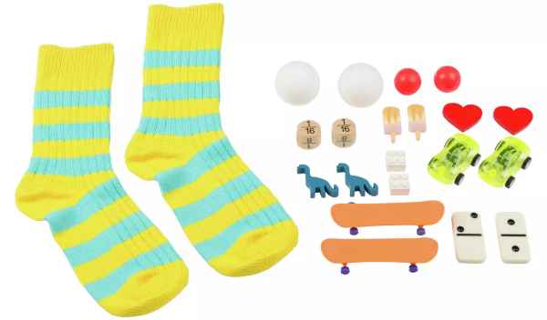 Yellow and blue striped socks with colorful miniature game pieces like skateboards, dinosaurs, and cars.
