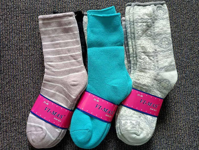 Pair of women's thick thermal crew socks from dealonline.co.nz in assorted colors, size 6-10, designed for warmth and comfort.