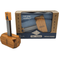Wooden block hammer puzzle with a Celtic knot handle next to its brown and blue display box featuring Viking runes.