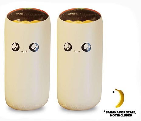 Two tall inflatable cream-colored burritos with cute cartoon faces and colorful tops. Includes a banana for scale.