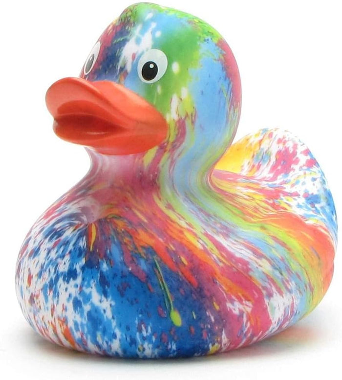 Vibrant toy duck with colorful tie-dye splatters of blue, pink, green, and yellow and a bright orange beak.