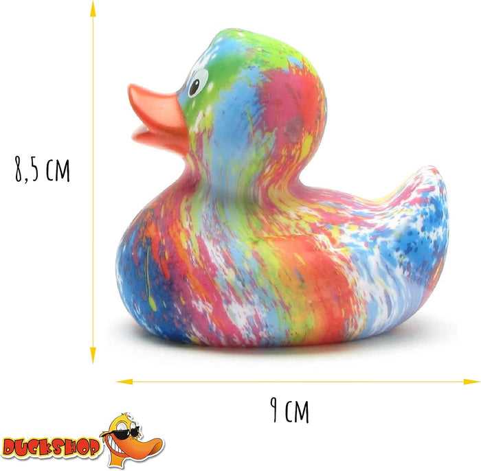 Multi-colored splattered paint rubber duck with orange beak. Height: 8.5 cm, Length: 9 cm.