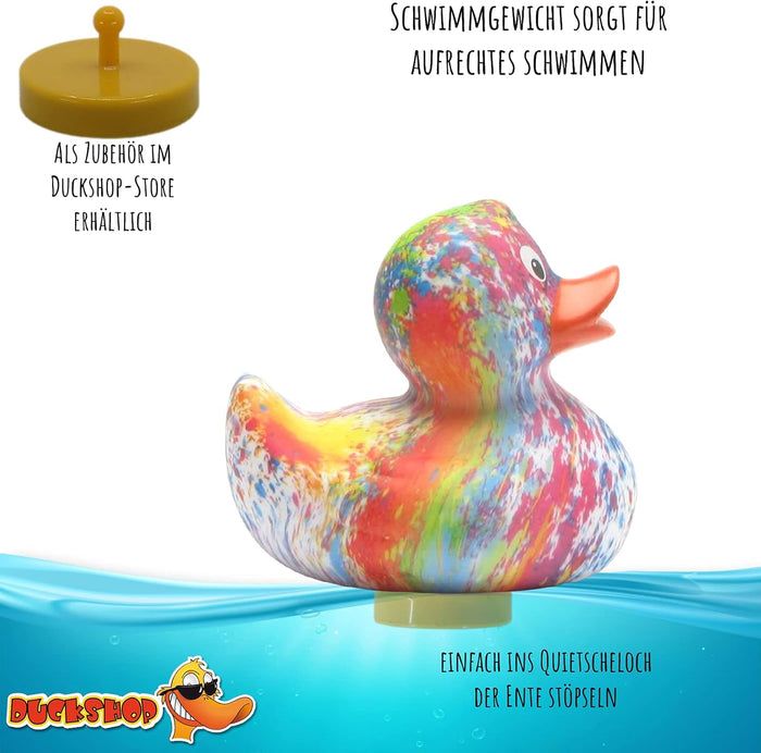 Colorful tie-dye rubber duck floating in water with a yellow stabilizing weight attached to its base.