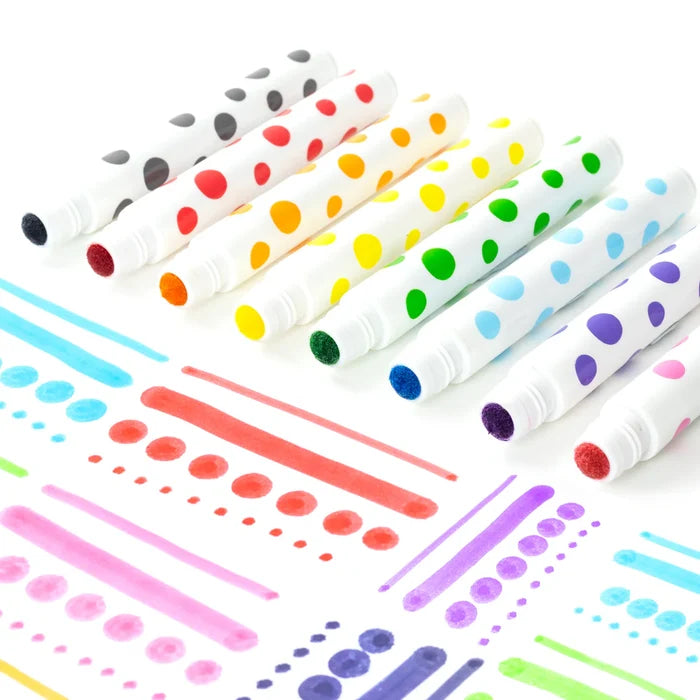 Eight sponge-tip markers with polka-dot barrels beside bright painted dots and lines on a white background.