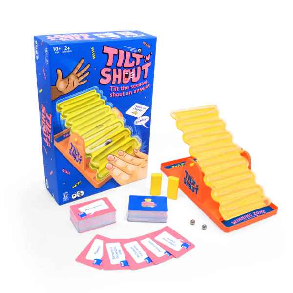 Tilt 'n Shout game including a blue box, orange tilting track board, metal balls, yellow blocks, and colorful cards.