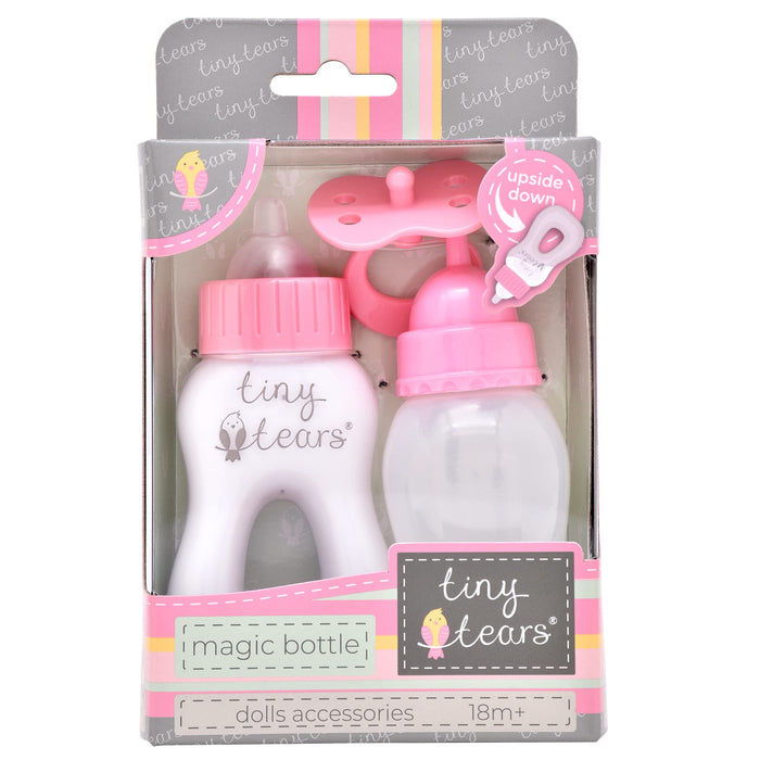 Pink and white toy doll feeding set with two magic bottles and a pacifier in a striped cardboard display box.