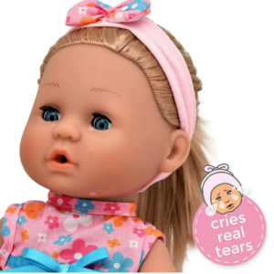Blonde baby doll with blue eyes and water droplet tears, wearing a pink floral headband and matching dress.