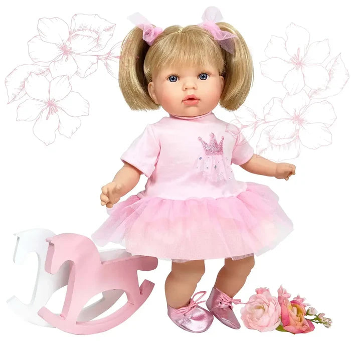 Blonde doll in pink pigtails and a tutu dress with a crown, standing by a pink rocking horse and roses.