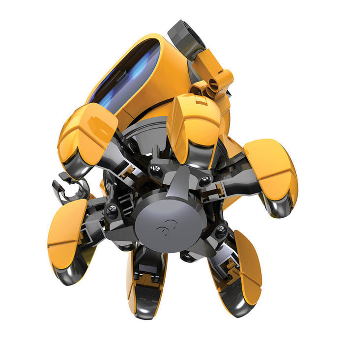 Yellow and black hexapod robot with six legs and a large blue visor screen, viewed from a low angle.