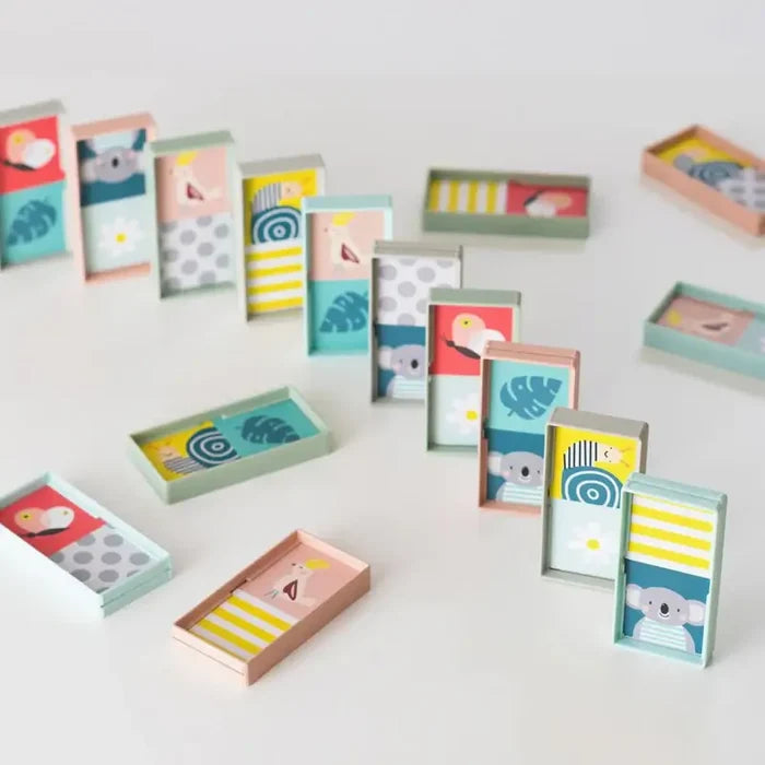 Rectangular blocks with colorful animal illustrations and patterns standing and lying on a white background.