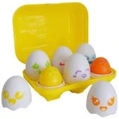 Yellow egg carton with six white toy eggs featuring colorful faces. Two eggs are open to show colored chicks inside.