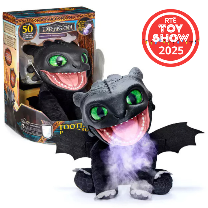 Black dragon toy with green eyes breathing purple mist, sitting with wings spread next to its retail box.