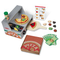 Grey wooden pizza oven toy with toppings tray, slices, peel, shaker, striped box, and play money.