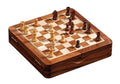 Small wooden travel chess set with light and dark magnetic pieces on a folding board that doubles as a storage case.