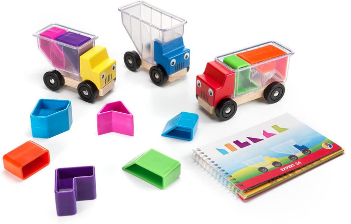 Three colorful toy trucks with clear bins, colorful geometric blocks, and a spiral-bound challenge booklet.