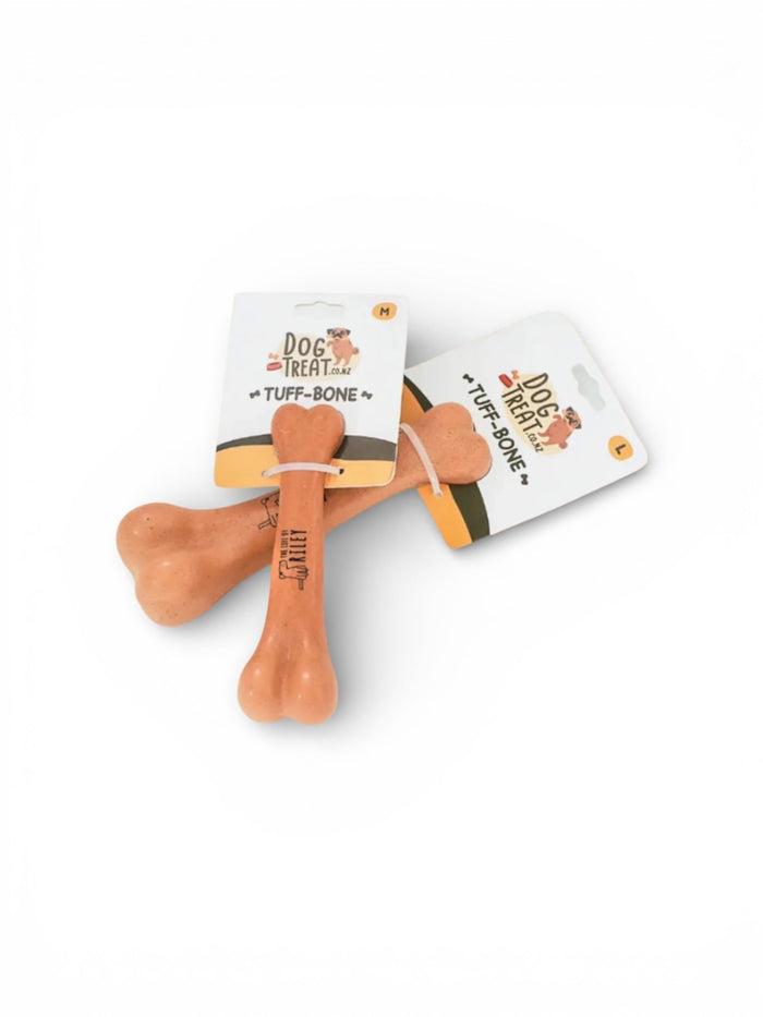 DogTreatNZ Tuff-Bone dog chew toy with durable, textured surface for strong chewers, designed for dogs' play and dental health.