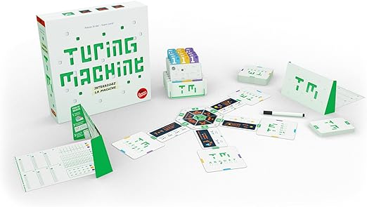 White game box with green pixelated text and spread-out components including punch cards and a central board.