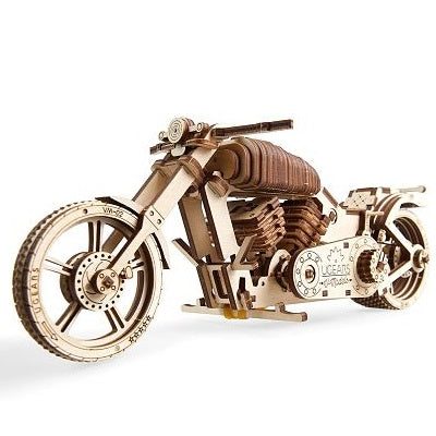 Intricate 3D wooden cruiser motorcycle model with laser-cut gears, spoked wheels, and a natural wood finish.