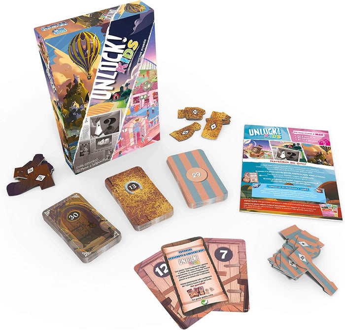 Colorful board game box with hot air balloon art, card decks, and game pieces spread out on a white surface.