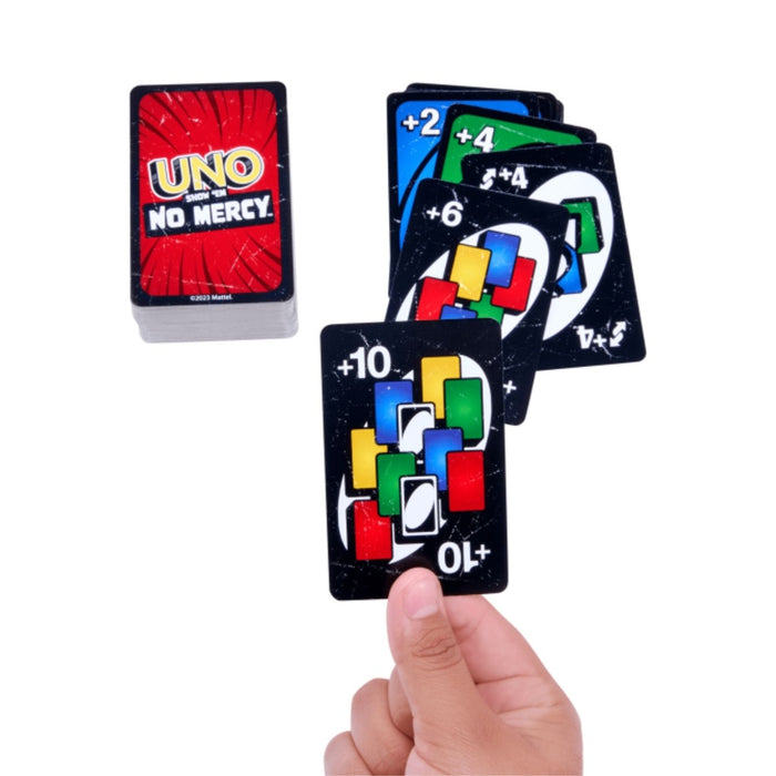 A hand holds a black +10 card from the Uno Show 'em No Mercy deck, next to fanned cards and a draw pile on white.