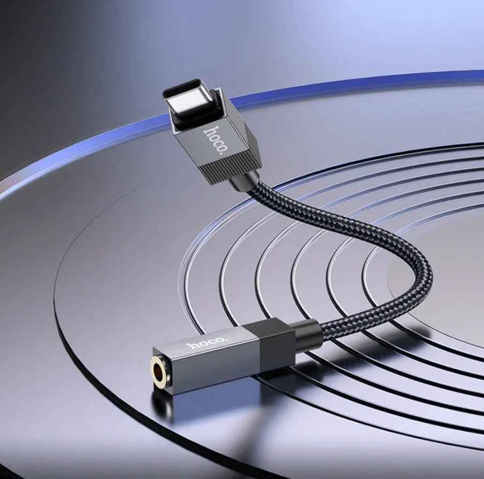 Techplus UPA32C Type C to 3.5mm audio adapter connected to a device, compact and lightweight design for versatile audio connection.