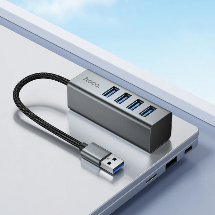 Techplus USB A to 4 Port USB 3.0 Expansion Hub with 5Gbps transfer speeds, shown connected to a computer.