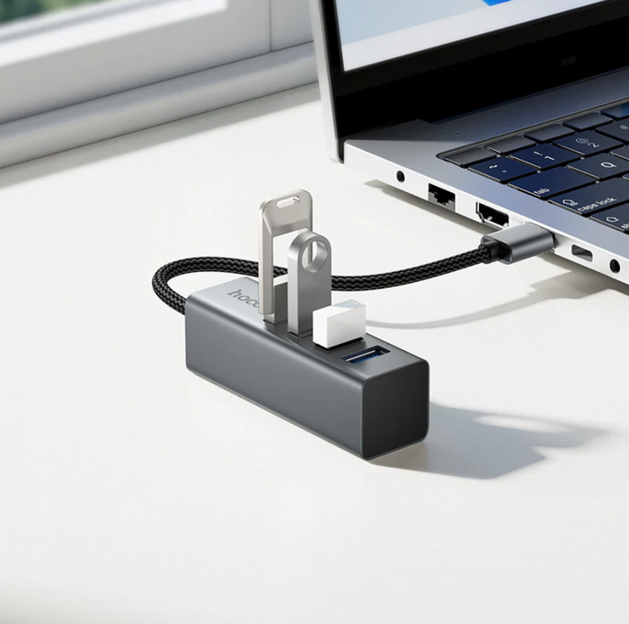 Techplus USB A to 4 Port USB 3.0 expansion hub with 5Gbps data transfer, shown connected to devices.