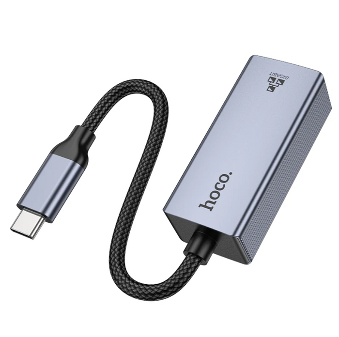 Techplus USB-C to RJ45 Ethernet adapter connected to a laptop, enabling 1000Mbps Gigabit LAN network access.
