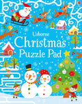 Bright blue cover featuring Santa, reindeer, snowmen, and elves in a snowy, festive winter landscape.