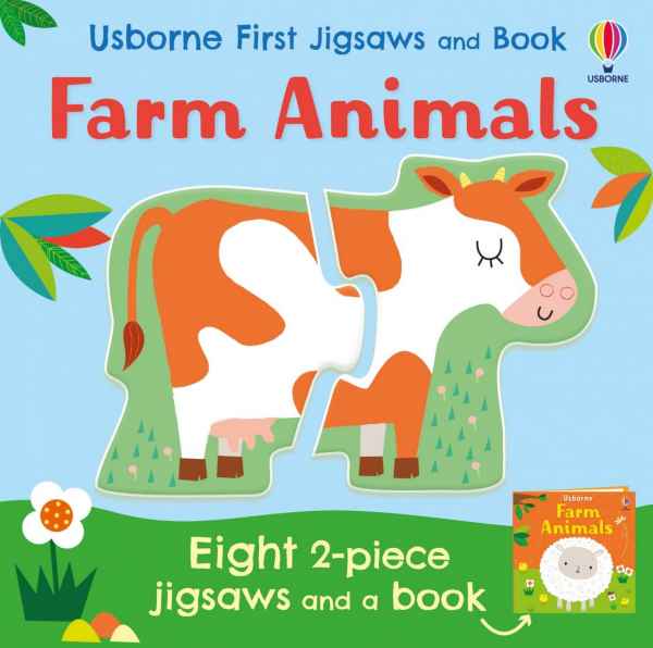 Blue square box showing a 2-piece cow jigsaw puzzle, green grass, and a mini book featuring a white sheep on the cover.