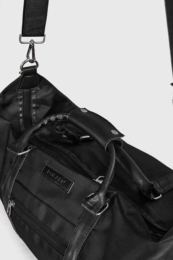 Black Vault Duffle Bag by Fuaark Nz, showing a spacious, stylish travel bag with sturdy handles and a sleek design.
