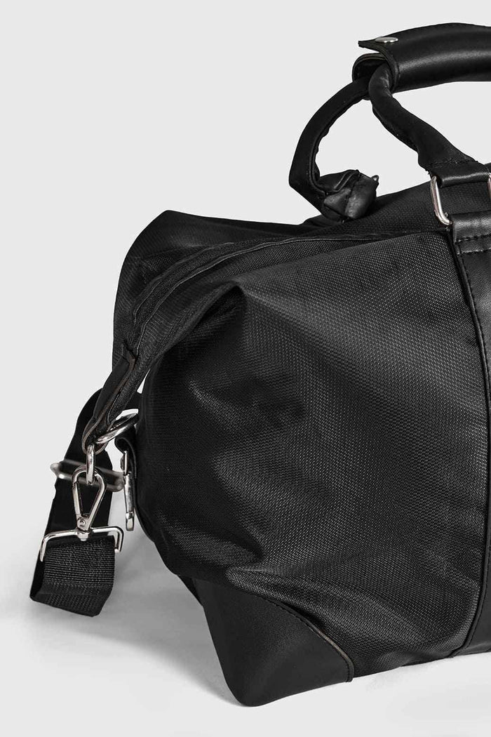 Black Vault Duffle Bag by Fuaark NZ featuring sturdy handles and spacious main compartment for travel or gym use.