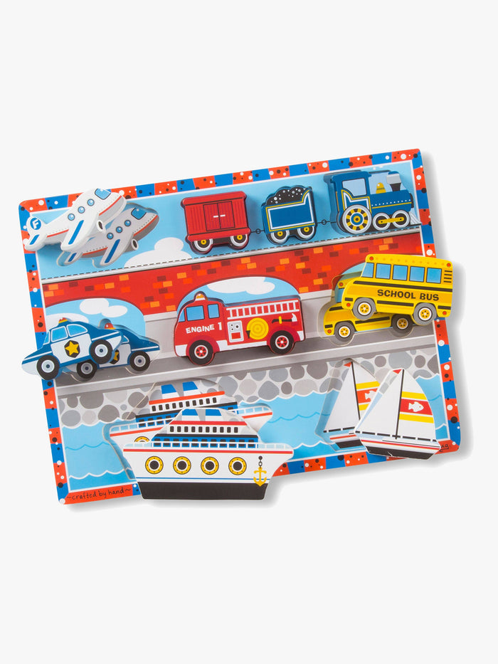 Colorful 9-piece wooden puzzle with chunky vehicle pieces including a train, fire engine, bus, plane, police car, and boats.