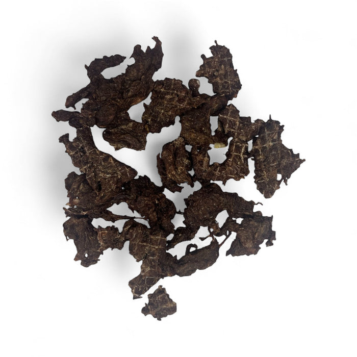 Dog Treats Venison Bites by DogTreatNZ, close-up of savory jerky-style venison treats for dogs on a white background.