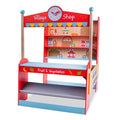 Red wooden toy shop featuring a clock, illustrated grocery shelves, and a fruit and vegetable counter.