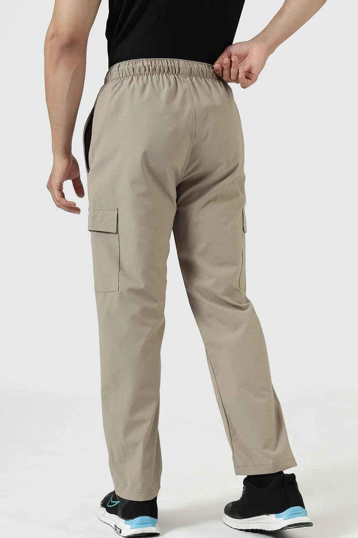 Beige Fuaark Nz Vitality Straight Track Pants displayed with a relaxed fit and elastic waistband.