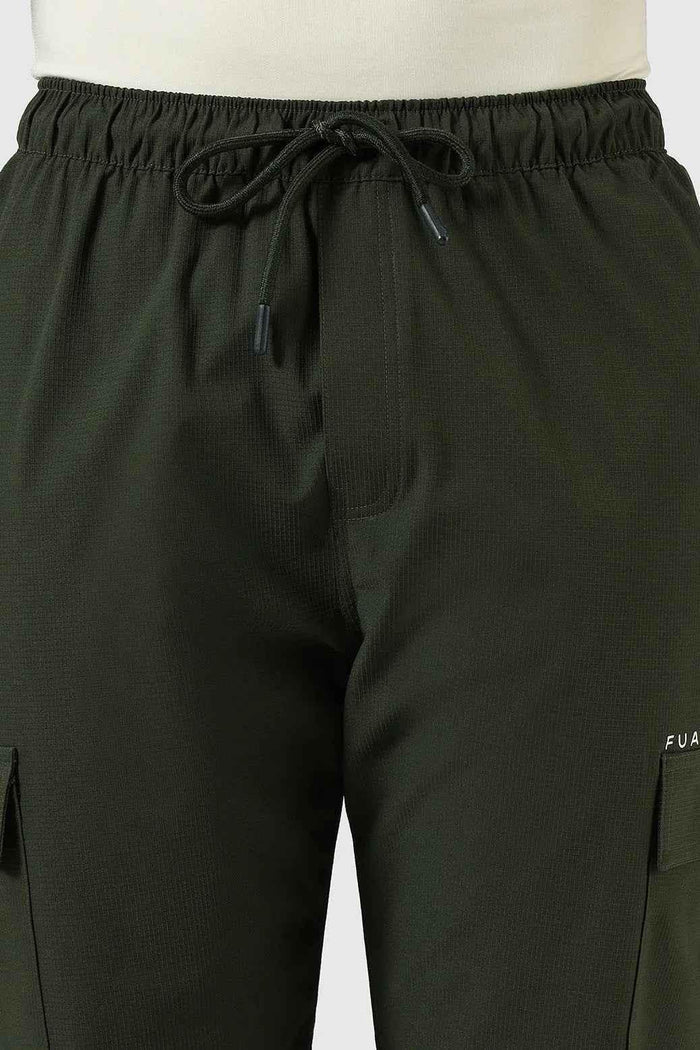 Olive green Fuaark Nz Vitality Straight Track Pants laid flat, showcasing their slim fit and casual design.