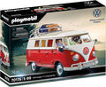 Playmobil toy box showing a red and white classic camper van with figures and luggage on a roof rack.