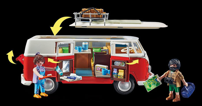 Red and white toy camper van with open side doors, removable roof, and two figures with vacation gear.