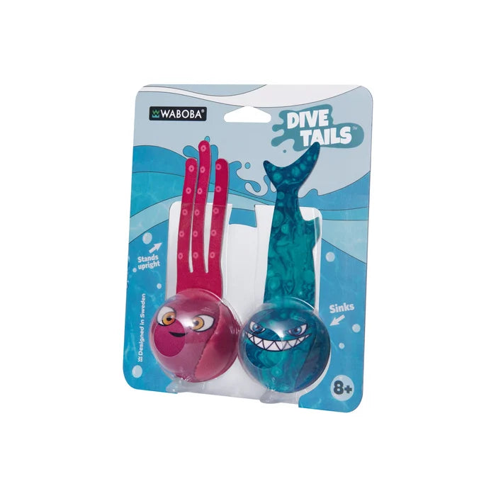 Pink octopus and teal shark weighted pool dive toys with fabric tails and cartoon faces in a blue package.