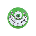 Circular green flying disc with a one-eyed cartoon monster face, small horns, and a wide toothy grin.