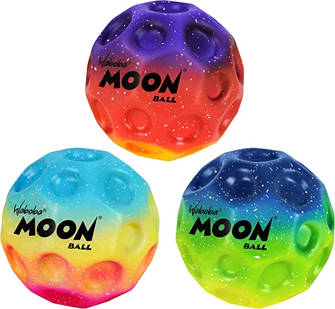 Three cratered balls with purple-orange, teal-pink, and blue-green gradients and white starry speckles.