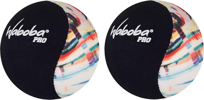 Two round fabric balls, half solid black with a white logo and half with a vibrant multi-colored abstract pattern.