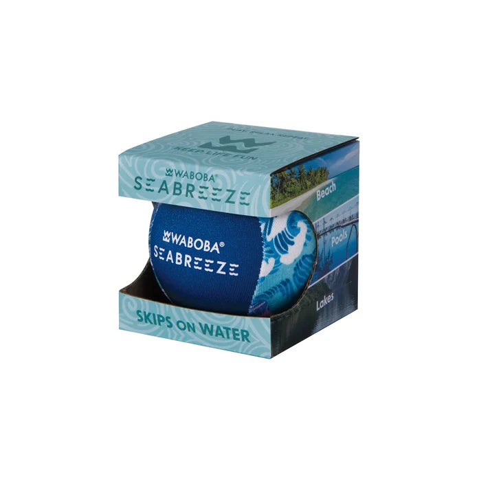 Blue and turquoise patterned ball in a light blue cardboard display box with beach scenes, labeled Skips on Water.