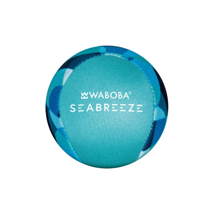 Spherical ball with blue camouflage patterns and a textured teal panel featuring white Waboba Seabreeze text.