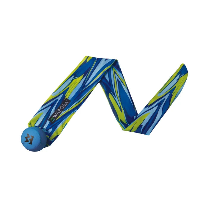 Blue foam ball attached to a long blue and lime green marbled fabric tail on a white background.
