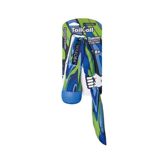 Blue and green swirl pattern ball with a long fabric tail, displayed on its original cardboard backing card.