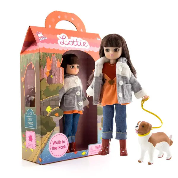 Lottie doll in a grey jacket and jeans walking a toy dog next to a house-shaped box with park illustrations.