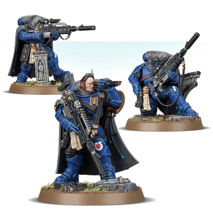 Three blue Space Marine snipers in black cloaks holding long rifles in various tactical combat poses.